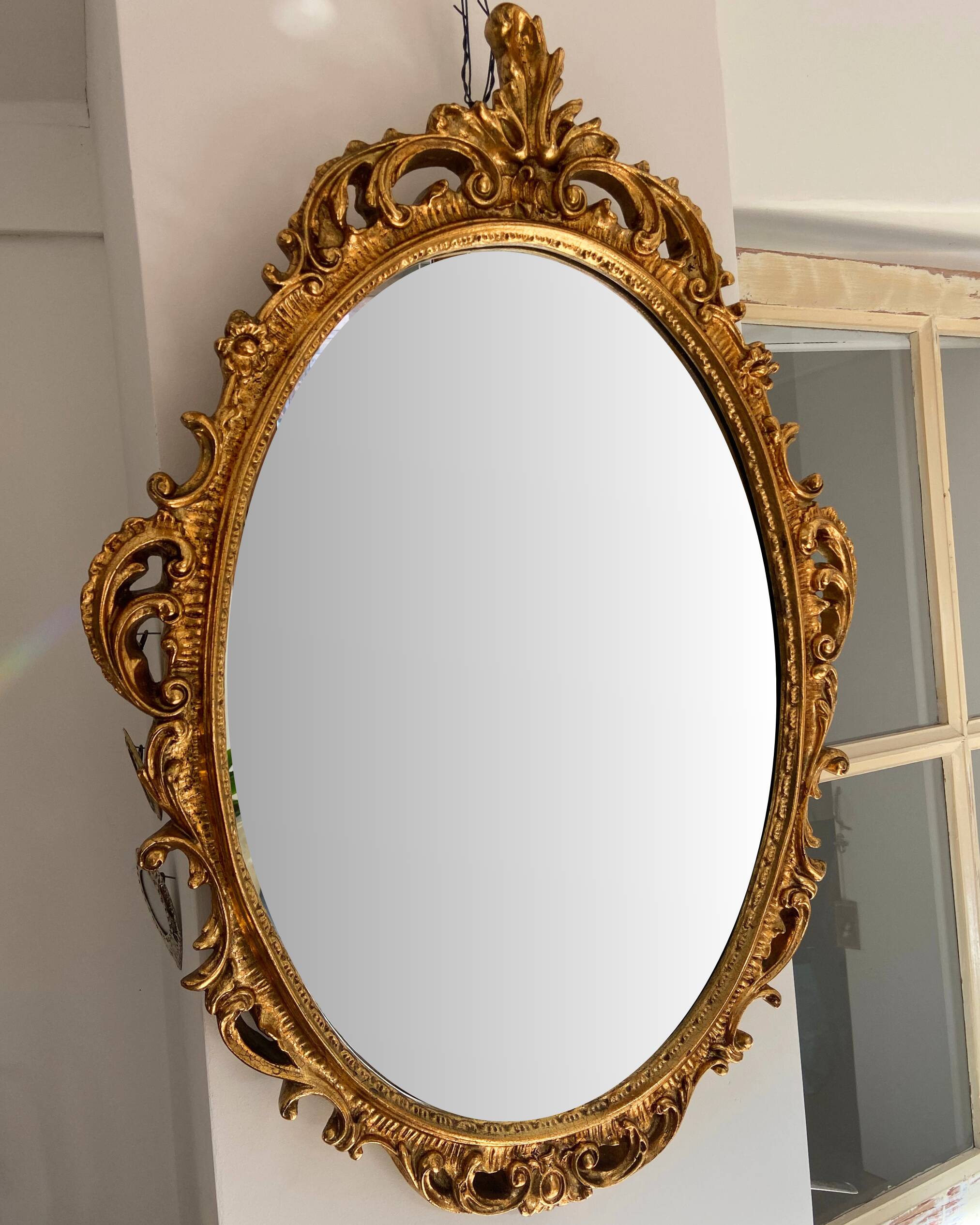 Beautiful Baroque Style Oval Decorative Mirror - Gilded with gold leaf with a Beautiful Patina