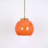 Orange glass pendant light by Peill Putzler, Germany, 1970.