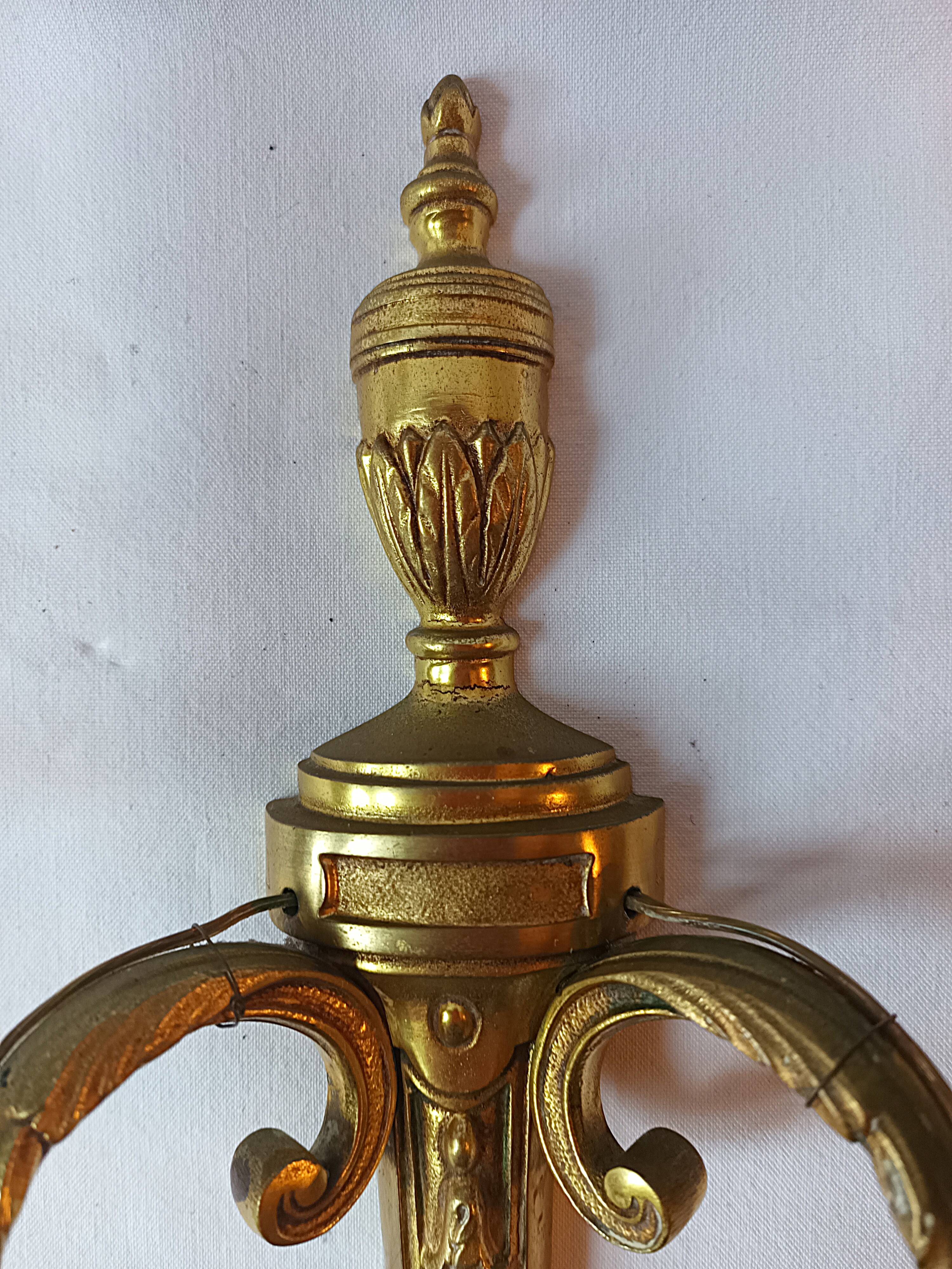 Pair of bronze wall sconces in Louis XVI style