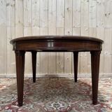 Oval dining table in Louis XVI style made of mahogany.