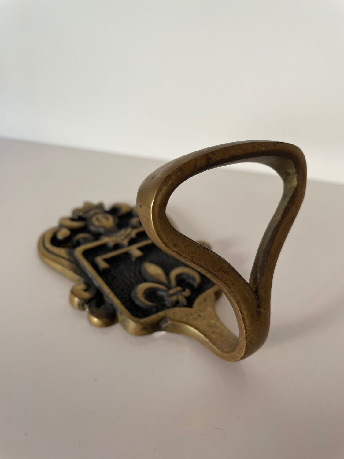 Brass hook fleur-de-lys decoration