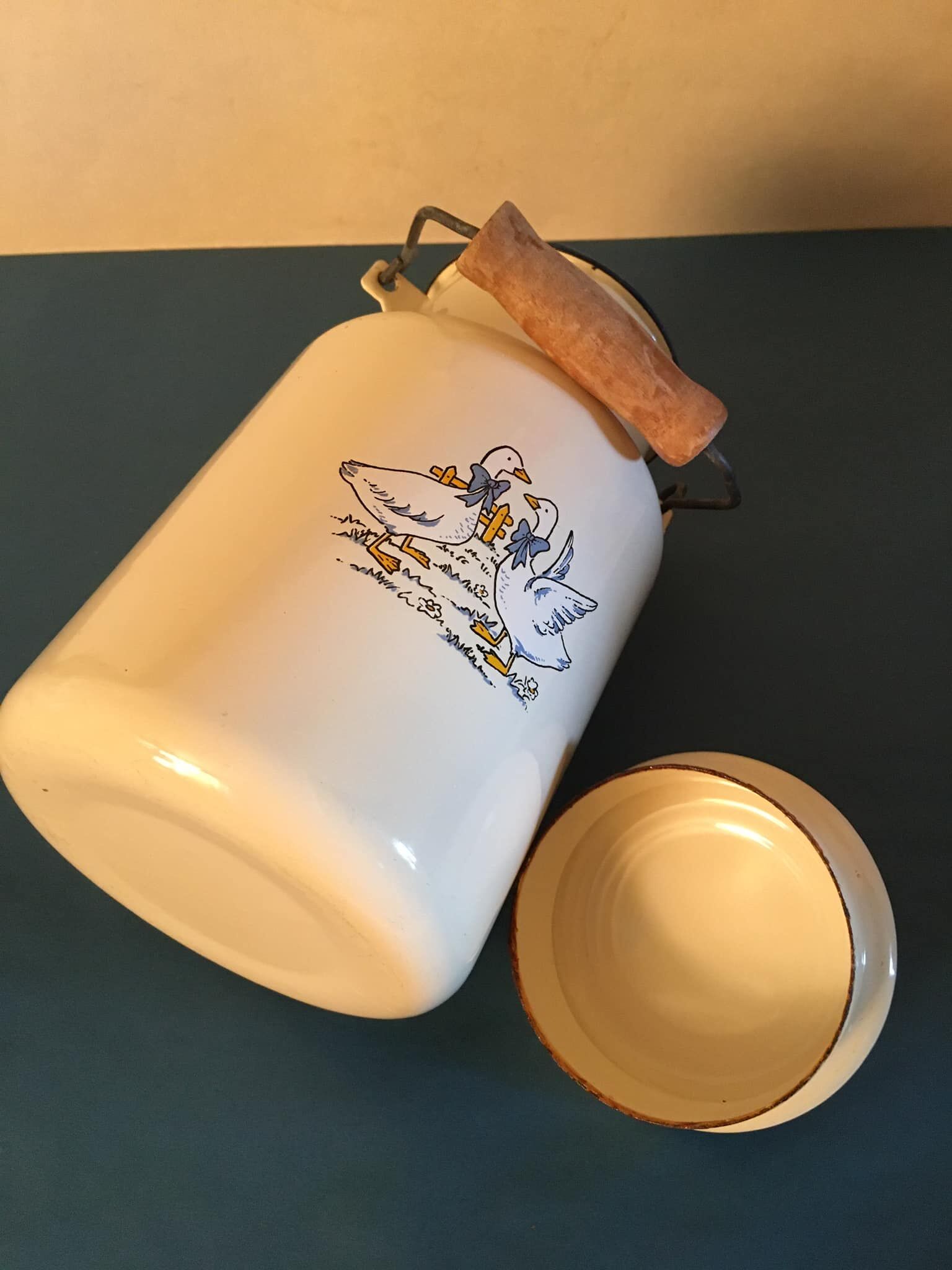 Enamelled milk jar retro style ecru color with "goose" patterns. Wooden handle.