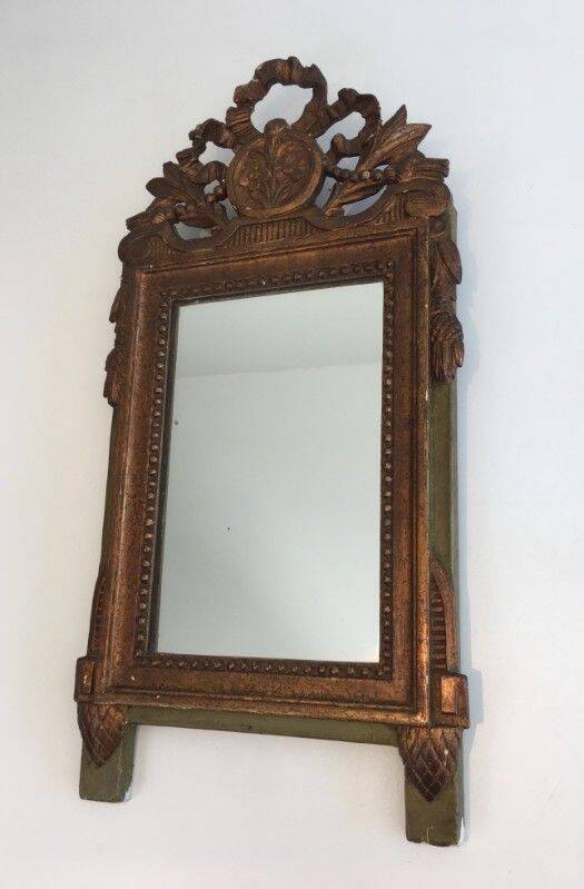 Louis XVI style mirror in patinated and gilded wood