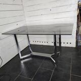 Chromed metal table with smoked glass top