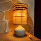 Table lamp in turned ceramic and wool