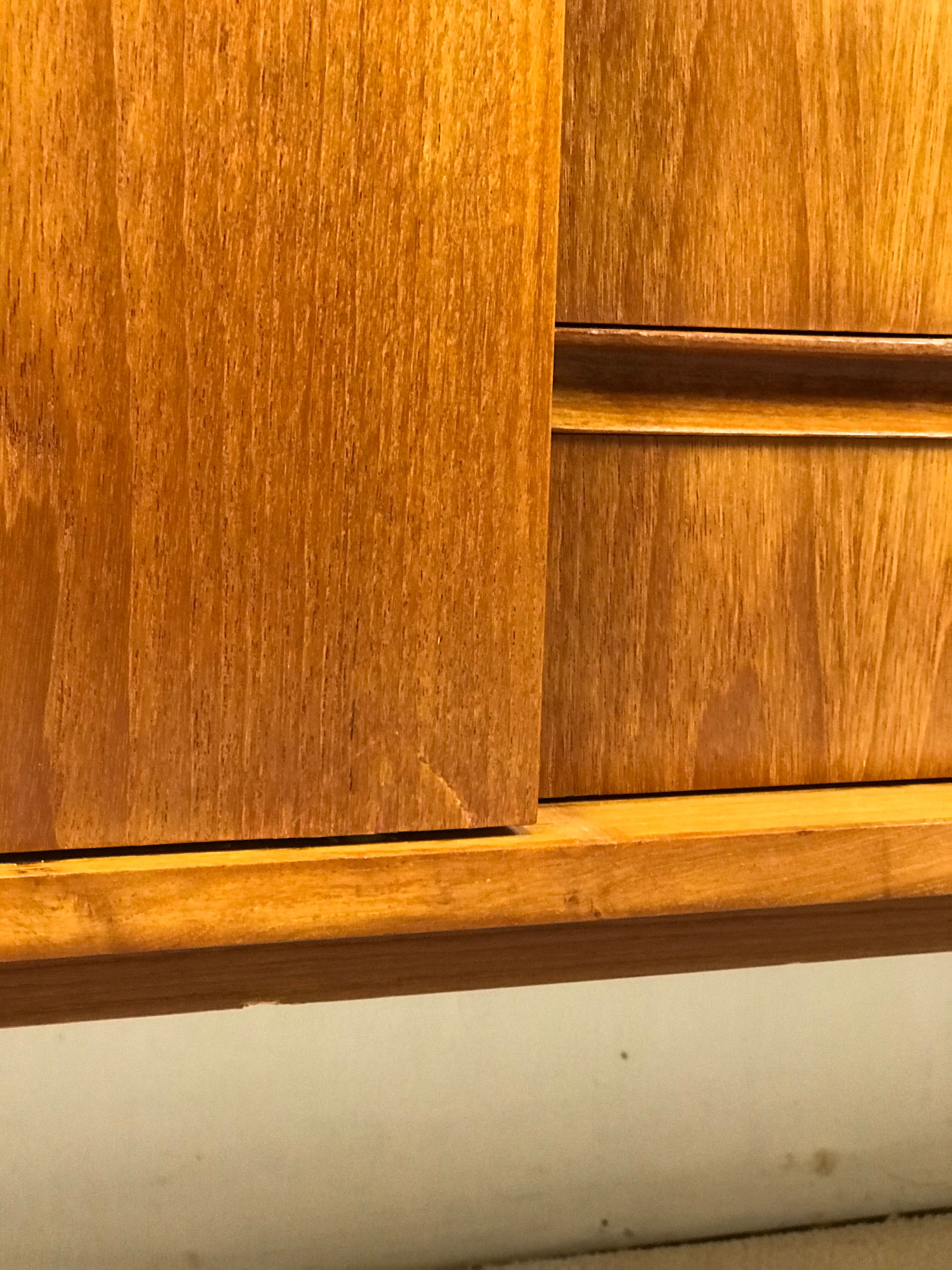 Danish teak sideboard with two sliding doors and 4 central drawers