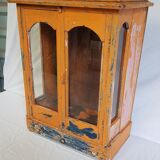 Old temple-showcase with teak offerings