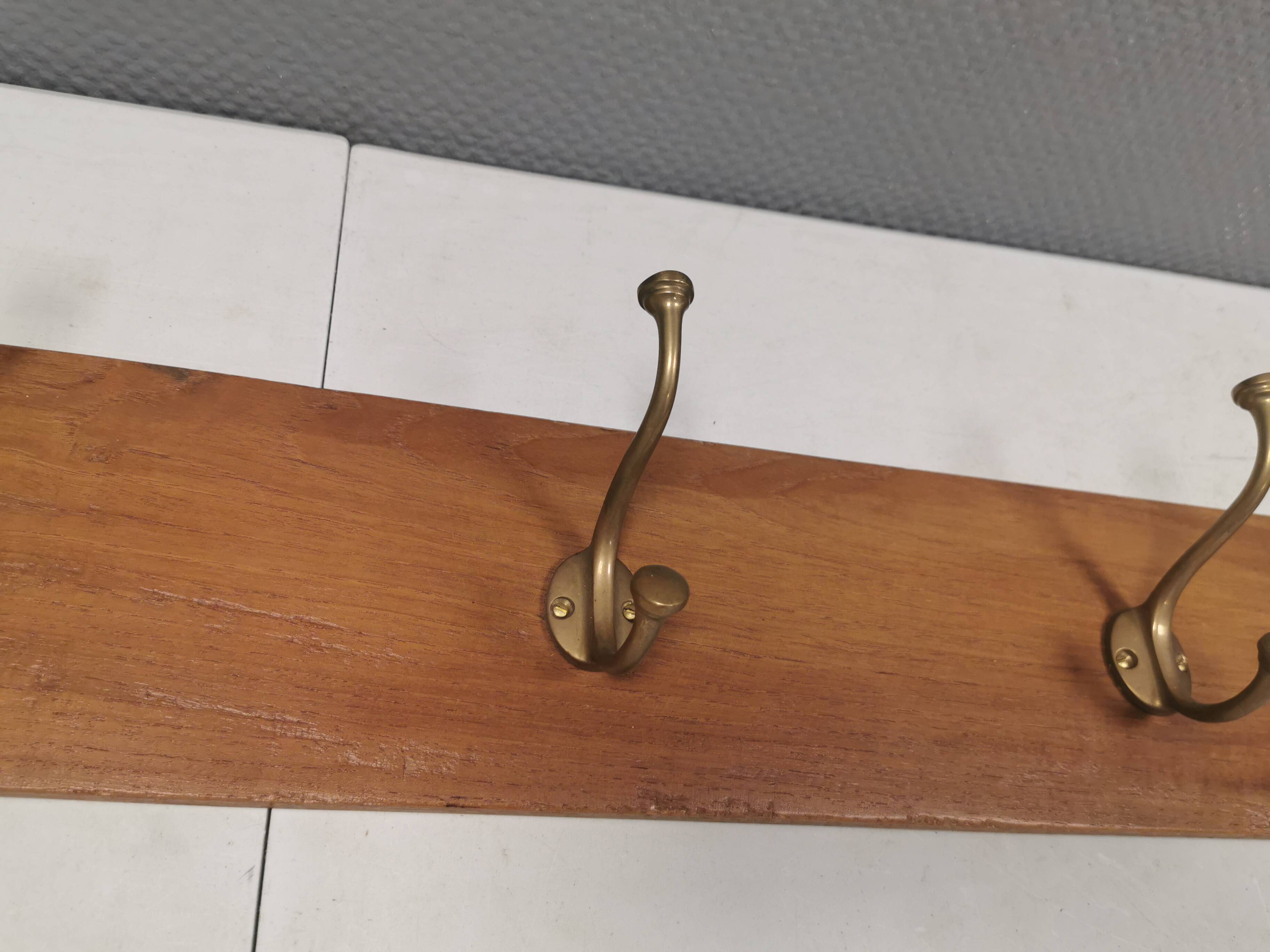 Coat rack in teak and brass. Denmark 1970-80s