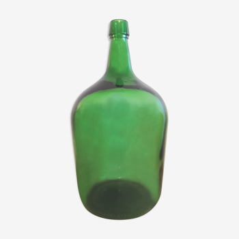 Demijohn in vintage green glass