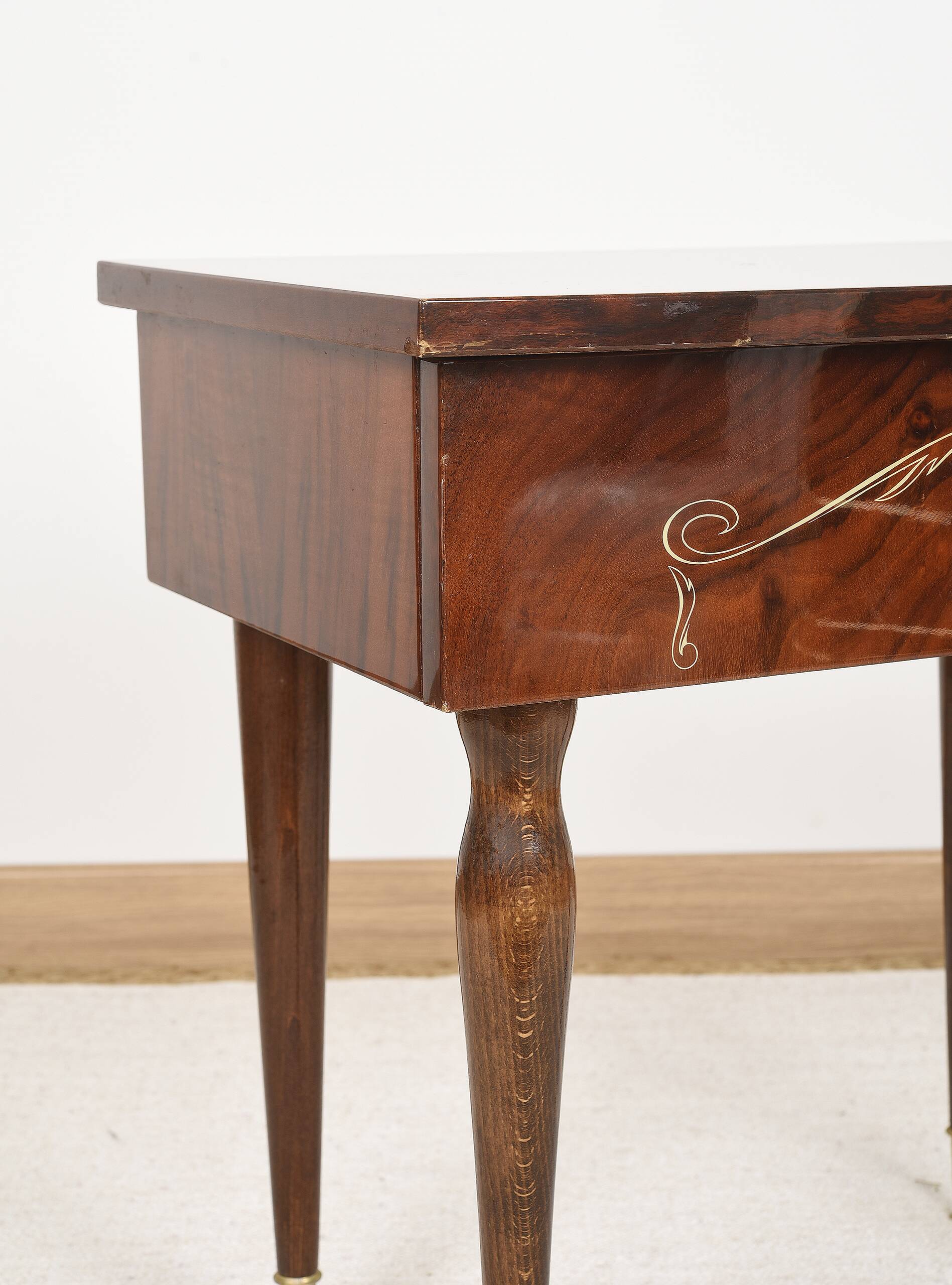 Vintage bedside table from the 70s in varnished wood.