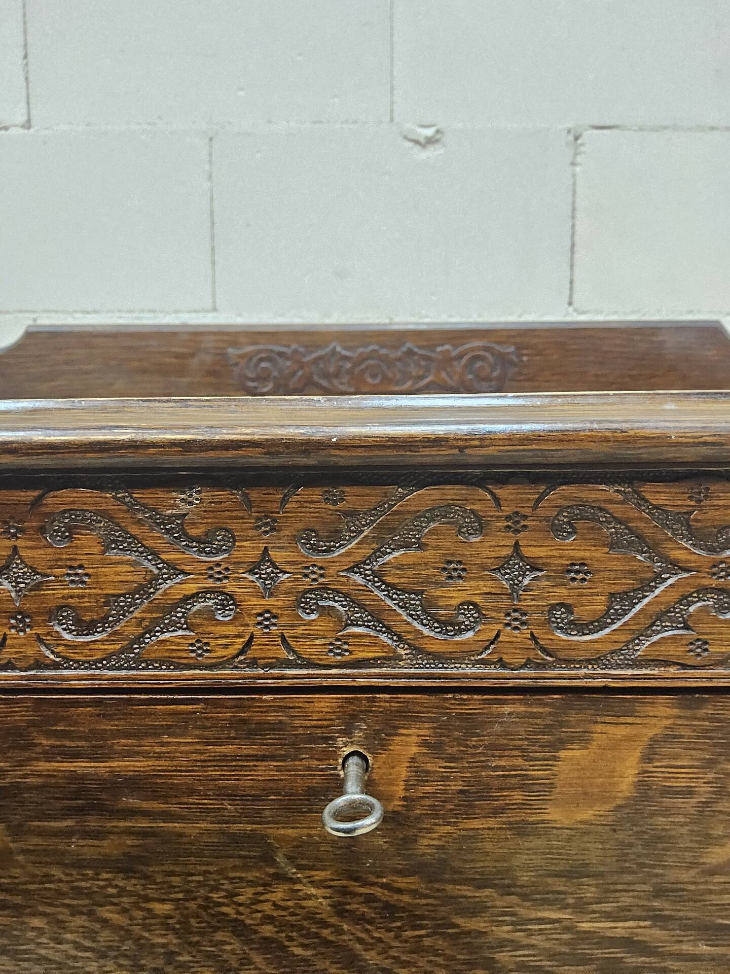Antique chest of drawers on wheels with wood carving (key top drawer)