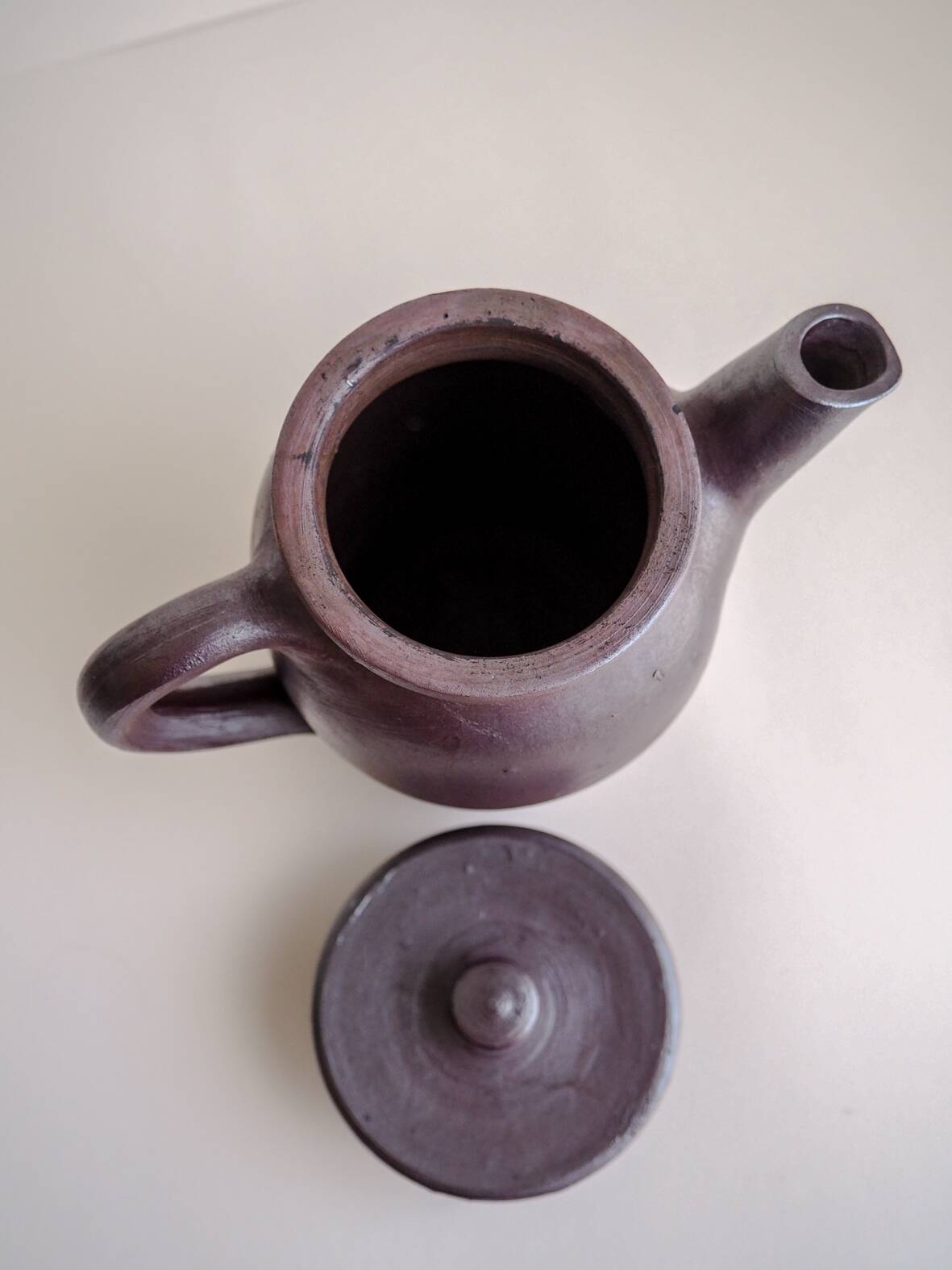Brown ceramic artisan coffee maker