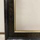 Black and gold frame decorated with Greek frieze decoration
