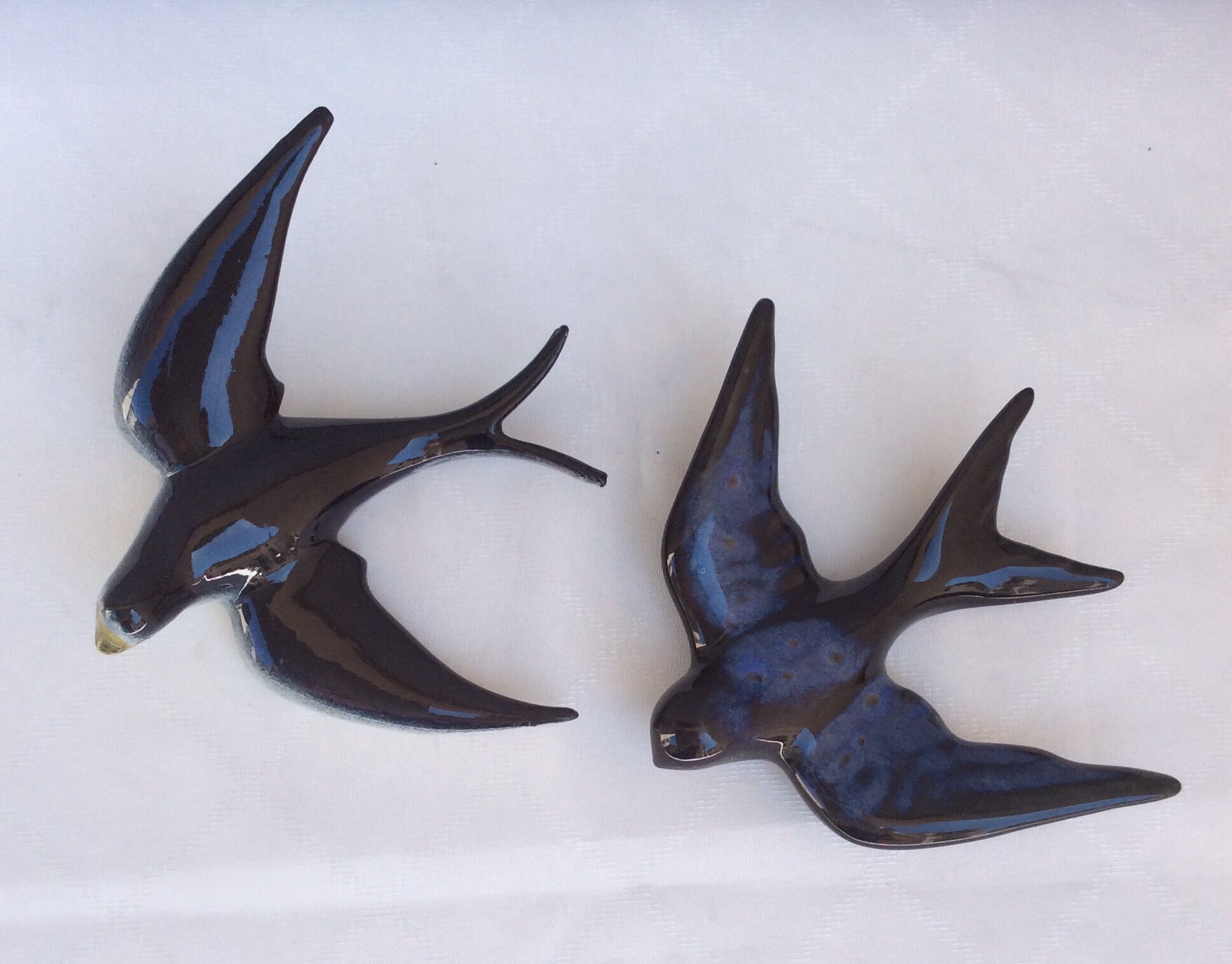 Two ceramic wall swallows