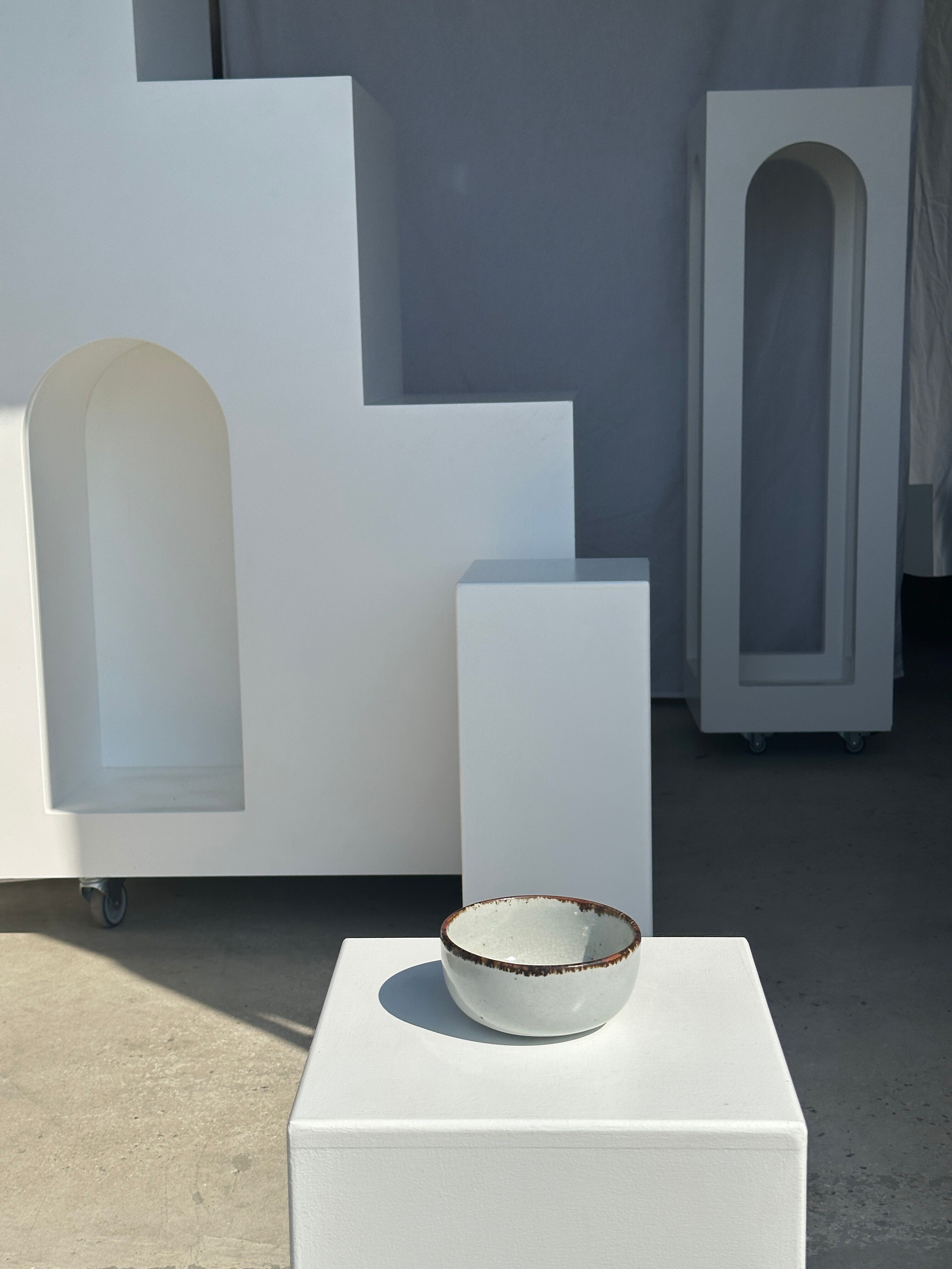 Small white glazed ceramic bowl black edges