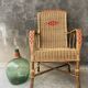 Vintage braided rattan armchair