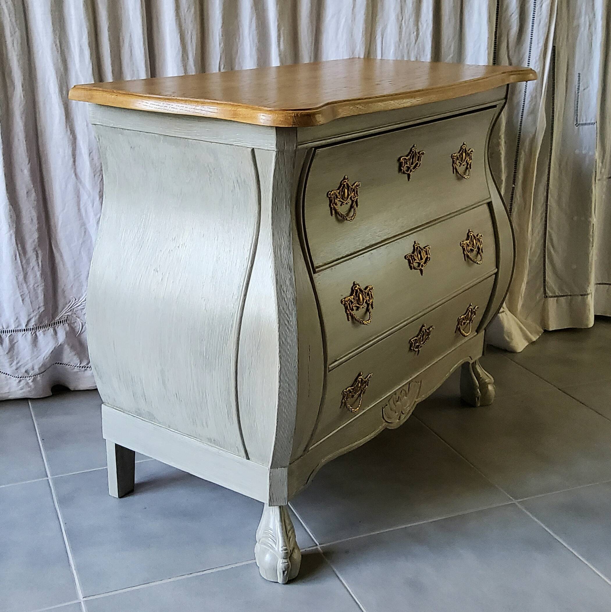 Curved patinated chest of drawers