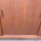Low sideboard with 3 sliding doors in teak. Denmark 1960