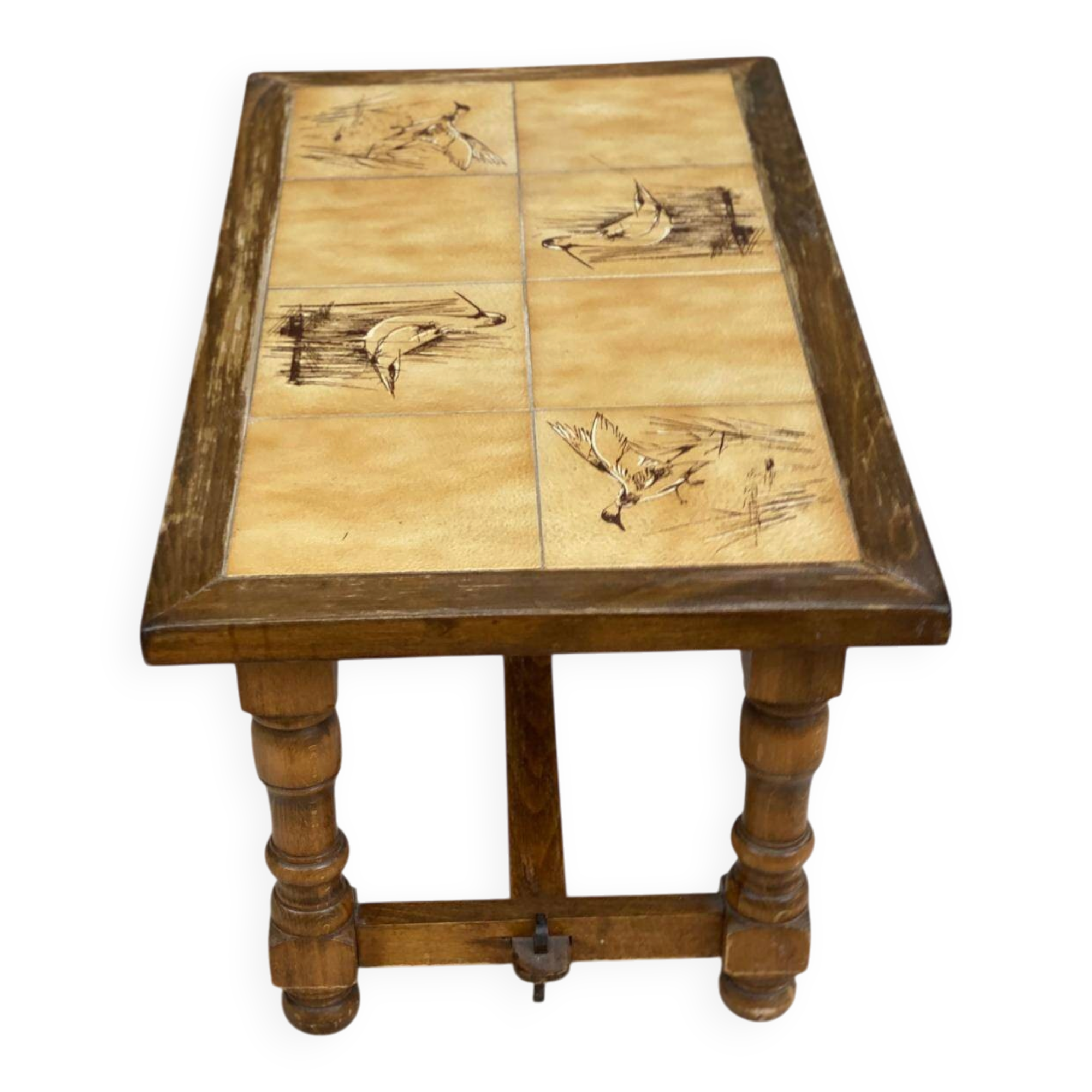 Vintage 70s coffee table with wood and ceramic tiles featuring bird and nature patterns.