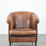 Sturdy vintage sheepskin club armchair with a beautiful patina