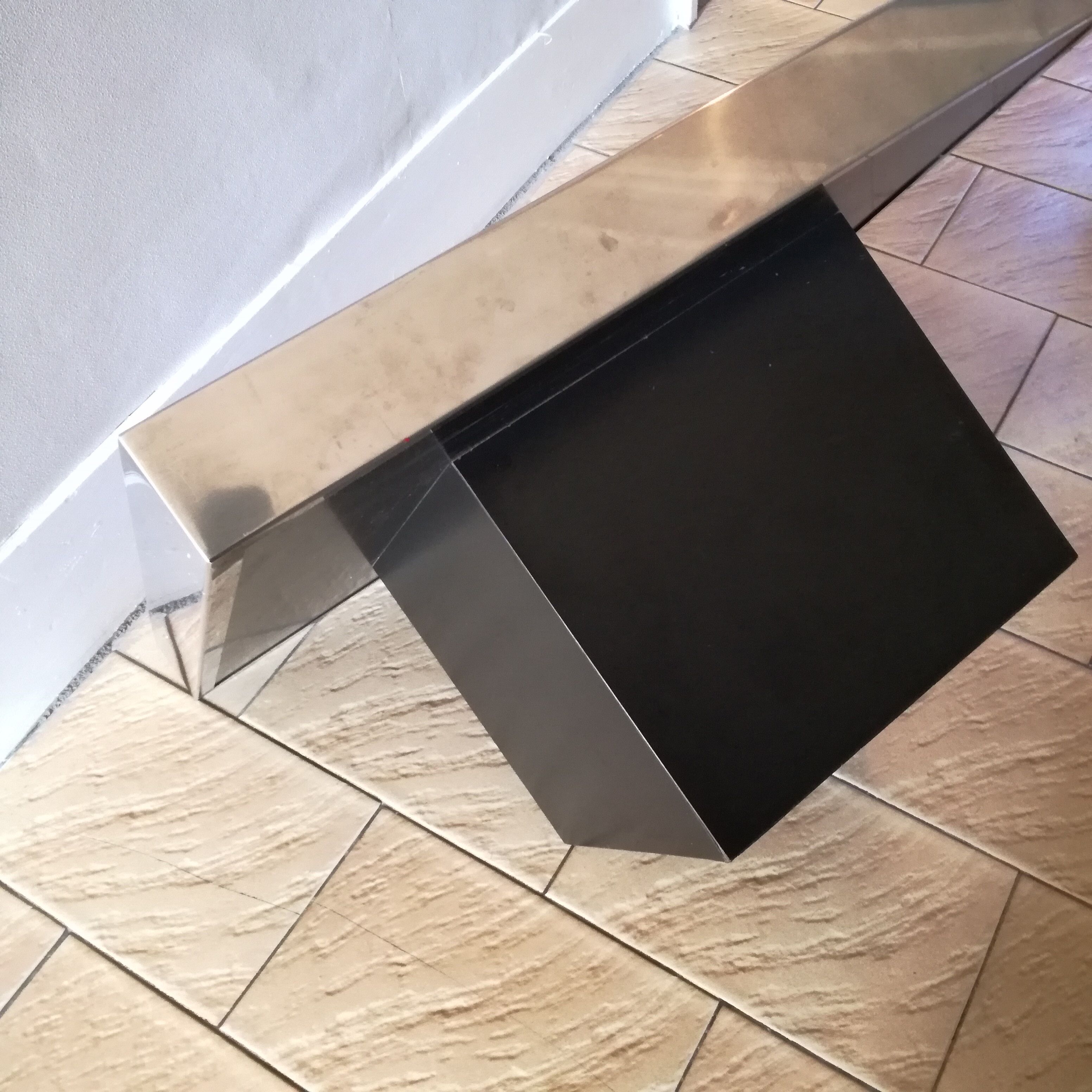 Square pedestal coffee table with mirror top
