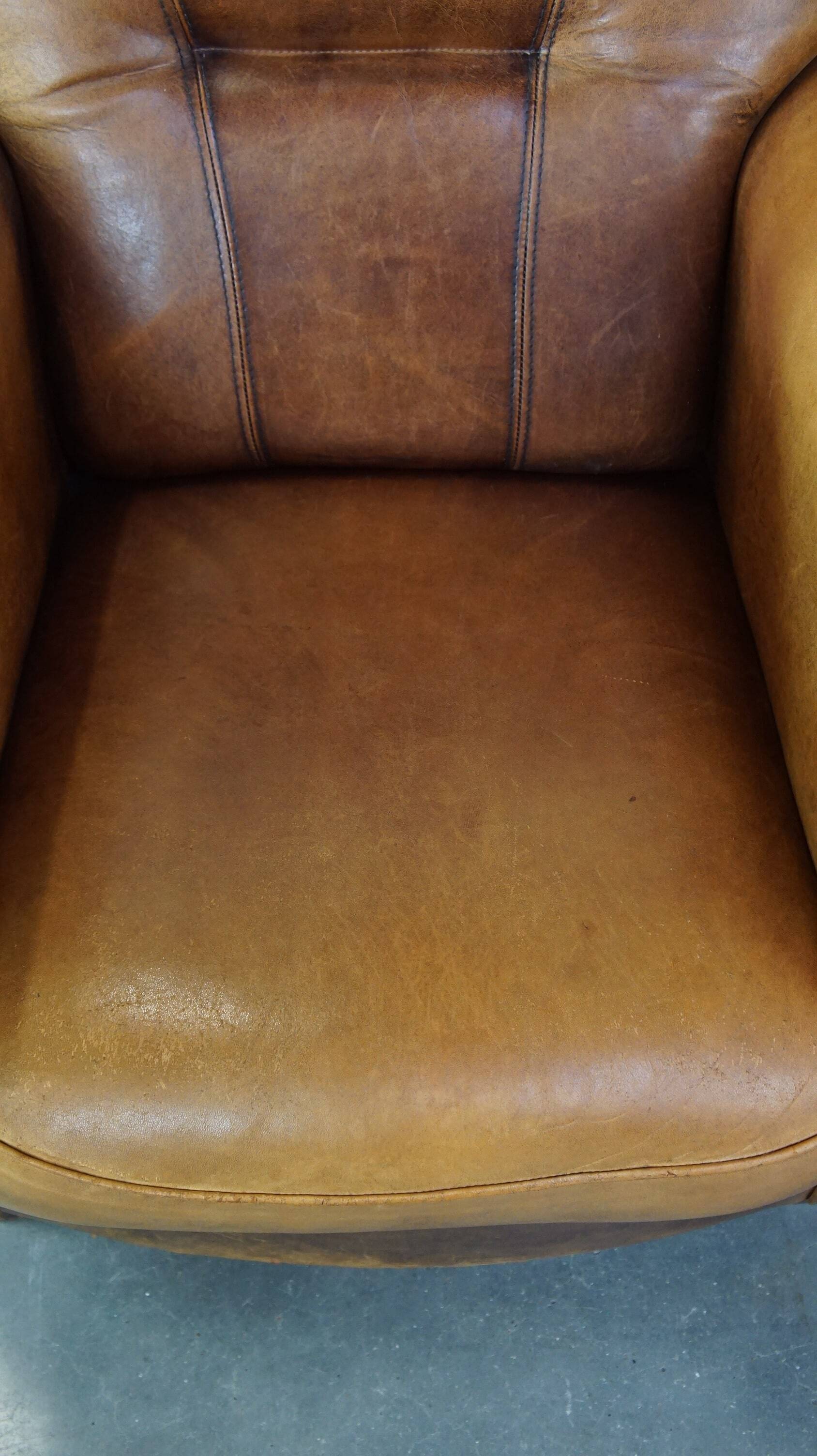 Stately, sleekly finished, comfortable sheepskin armchair