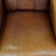 Stately, sleekly finished, comfortable sheepskin armchair