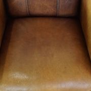 Stately, sleekly finished, comfortable sheepskin armchair