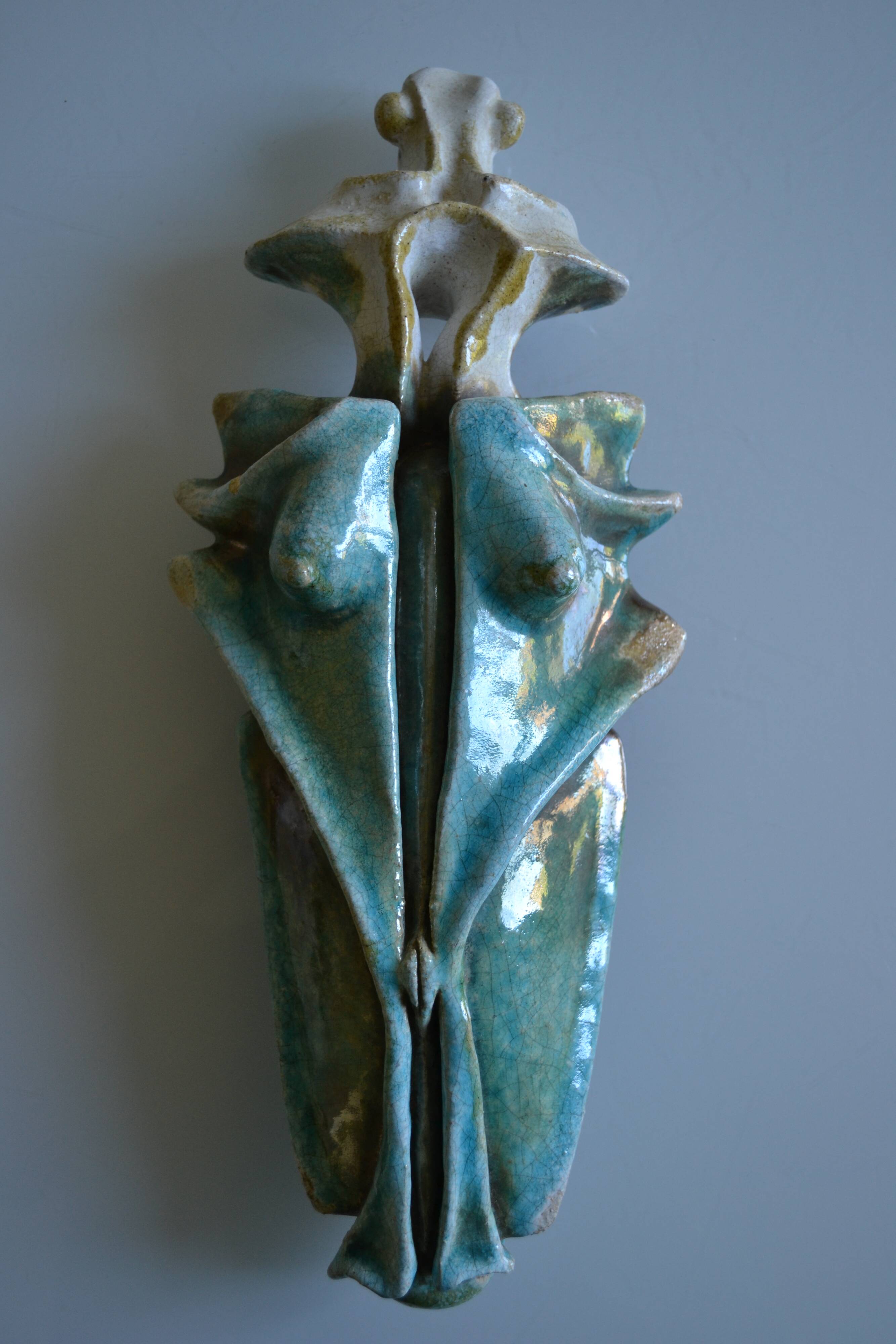 Surreal ceramic sculpture in relief signed to be identified.