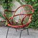 Rattan shell armchair with metal feet