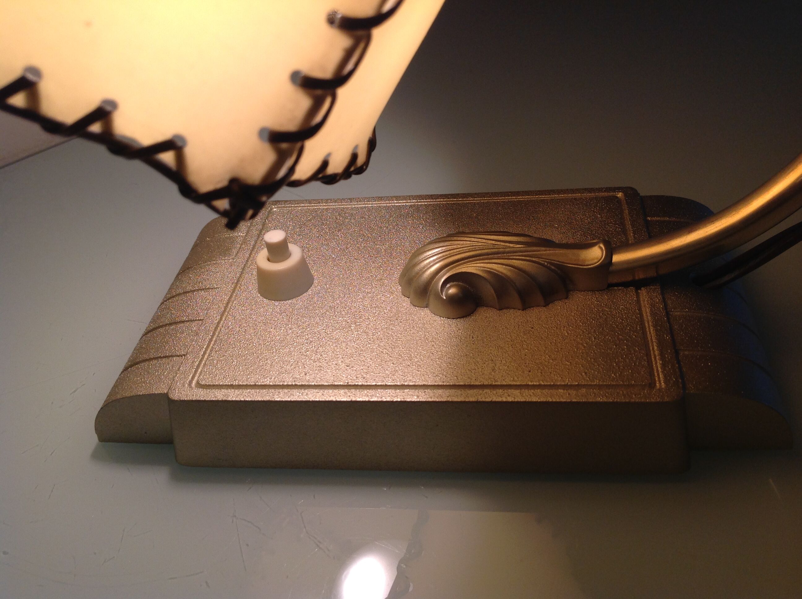 Brass bedside lamp and beige lampshade art deco style