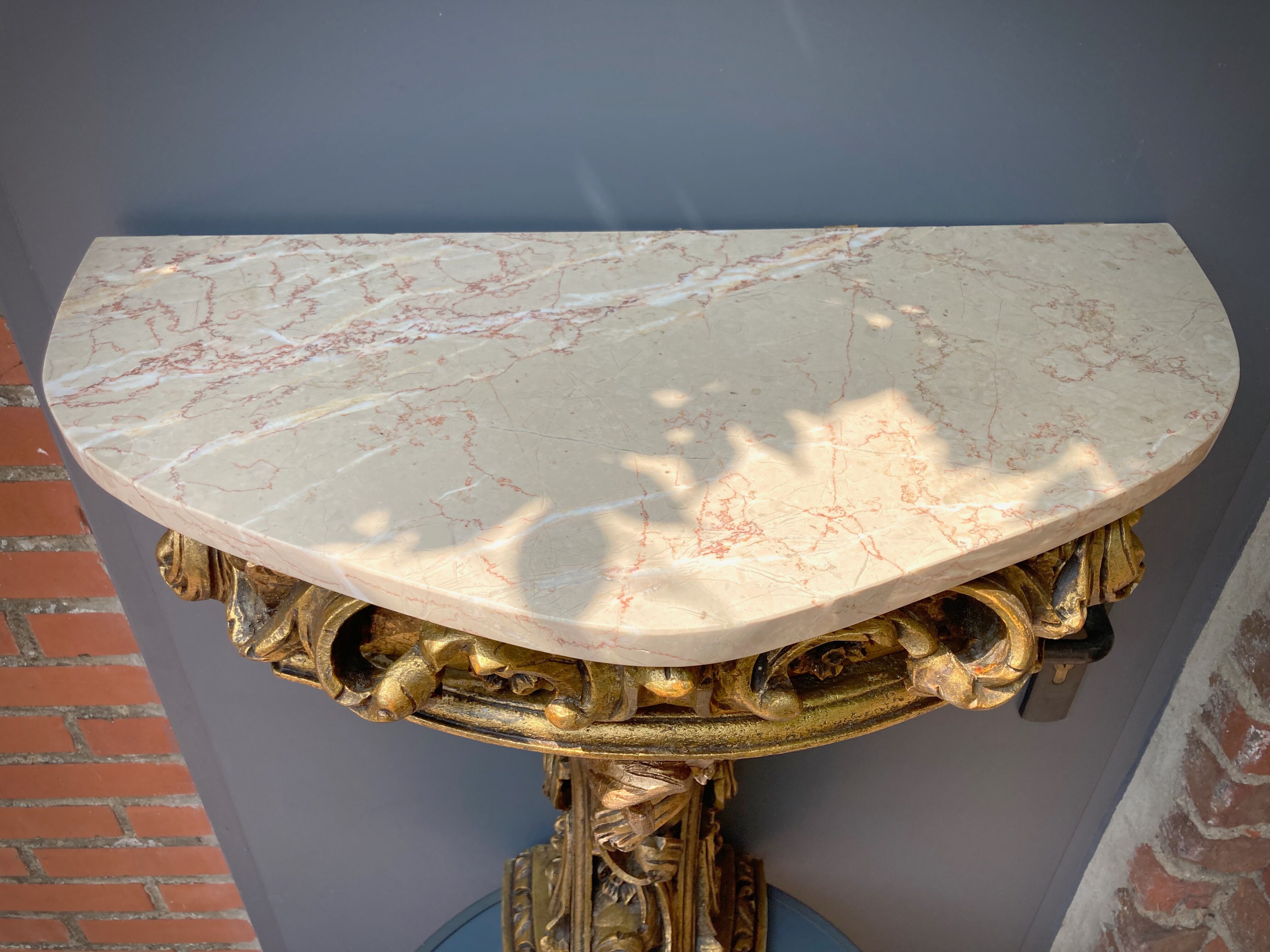 Carved wooden and marble console