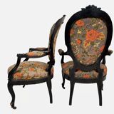 Pair of Napoleon III armchairs, in blackened wood, floral patterned fabric