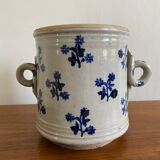 Old pot, sandstone, blue flower decoration