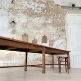 Solid wood workshop table with straight legs.