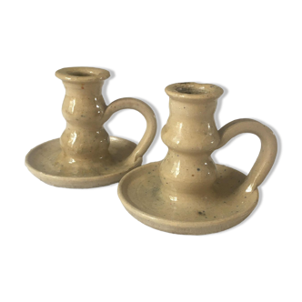 Pair of speckled sandstone candle holders