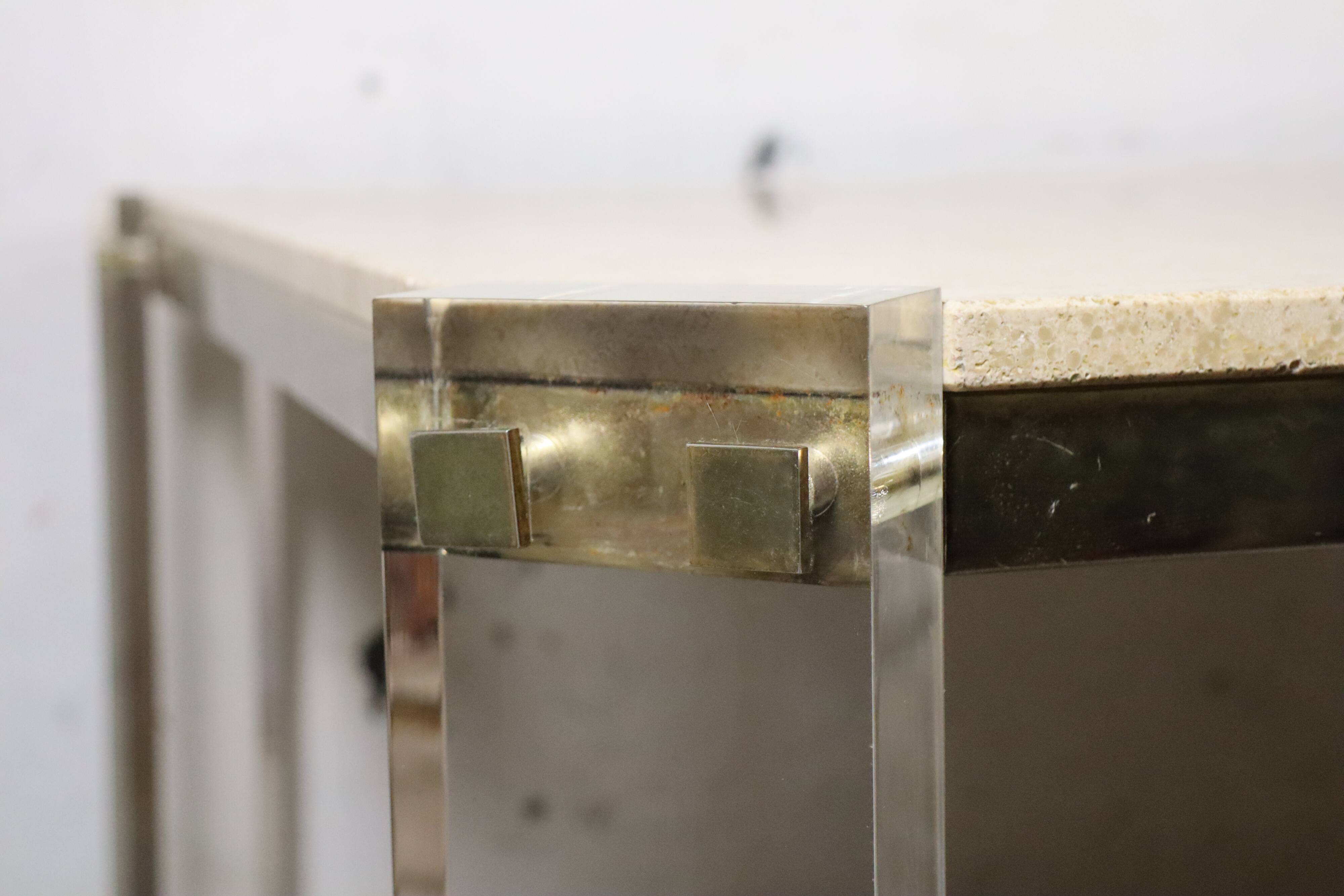 1970s dining table in travertine, gold metal and plexiglass.