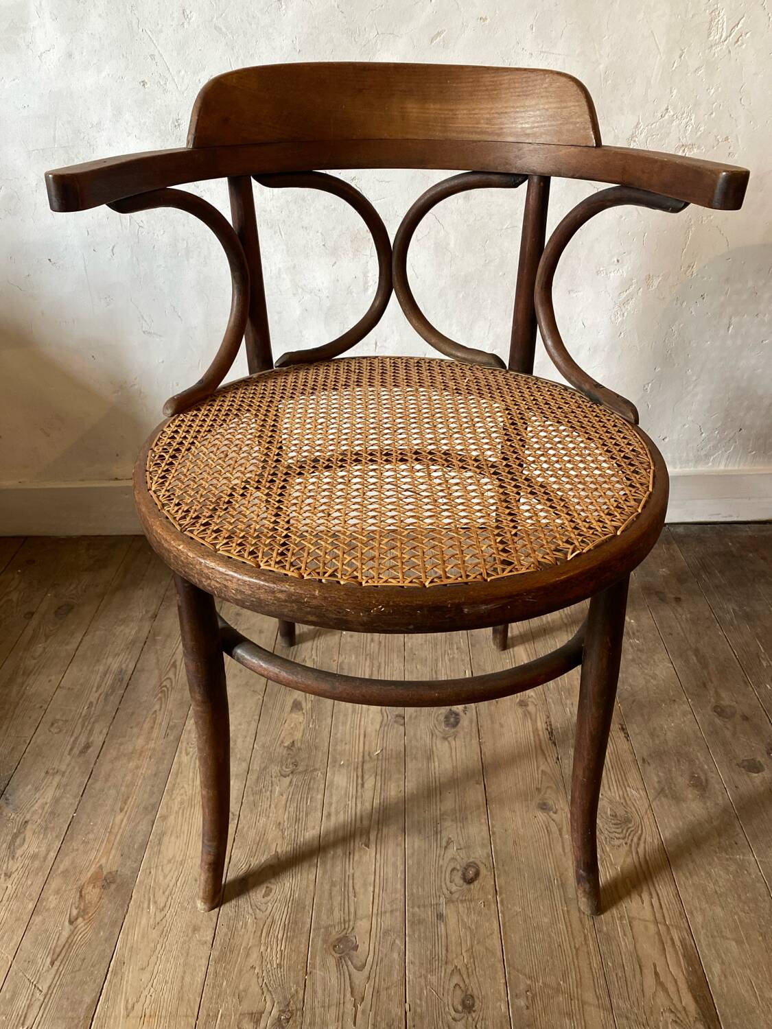 Cane and curved wood armchair