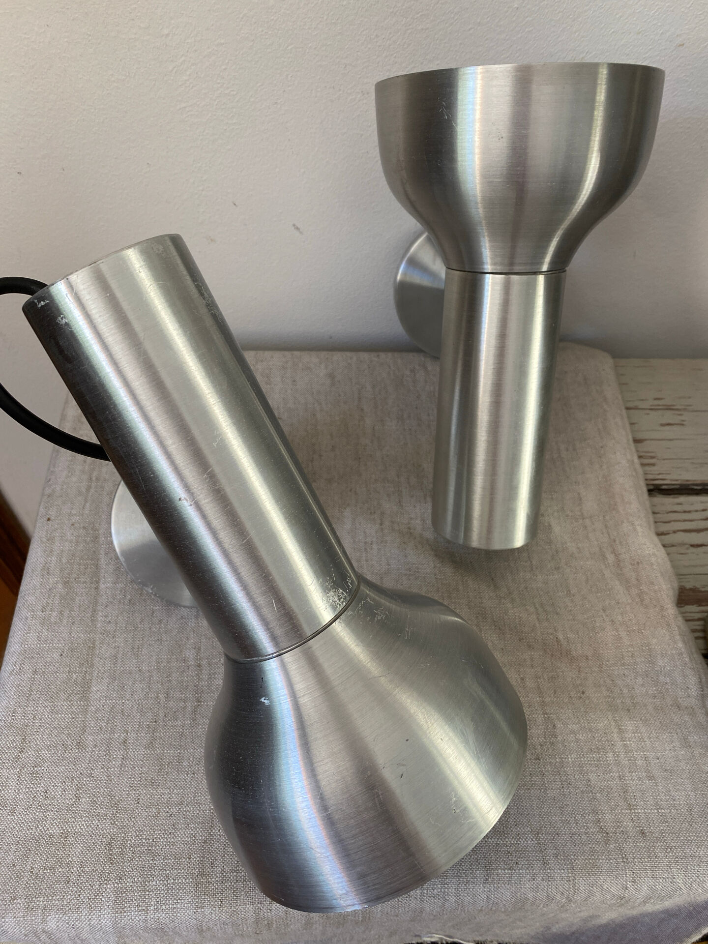 Pair of brushed metal wall sconces
