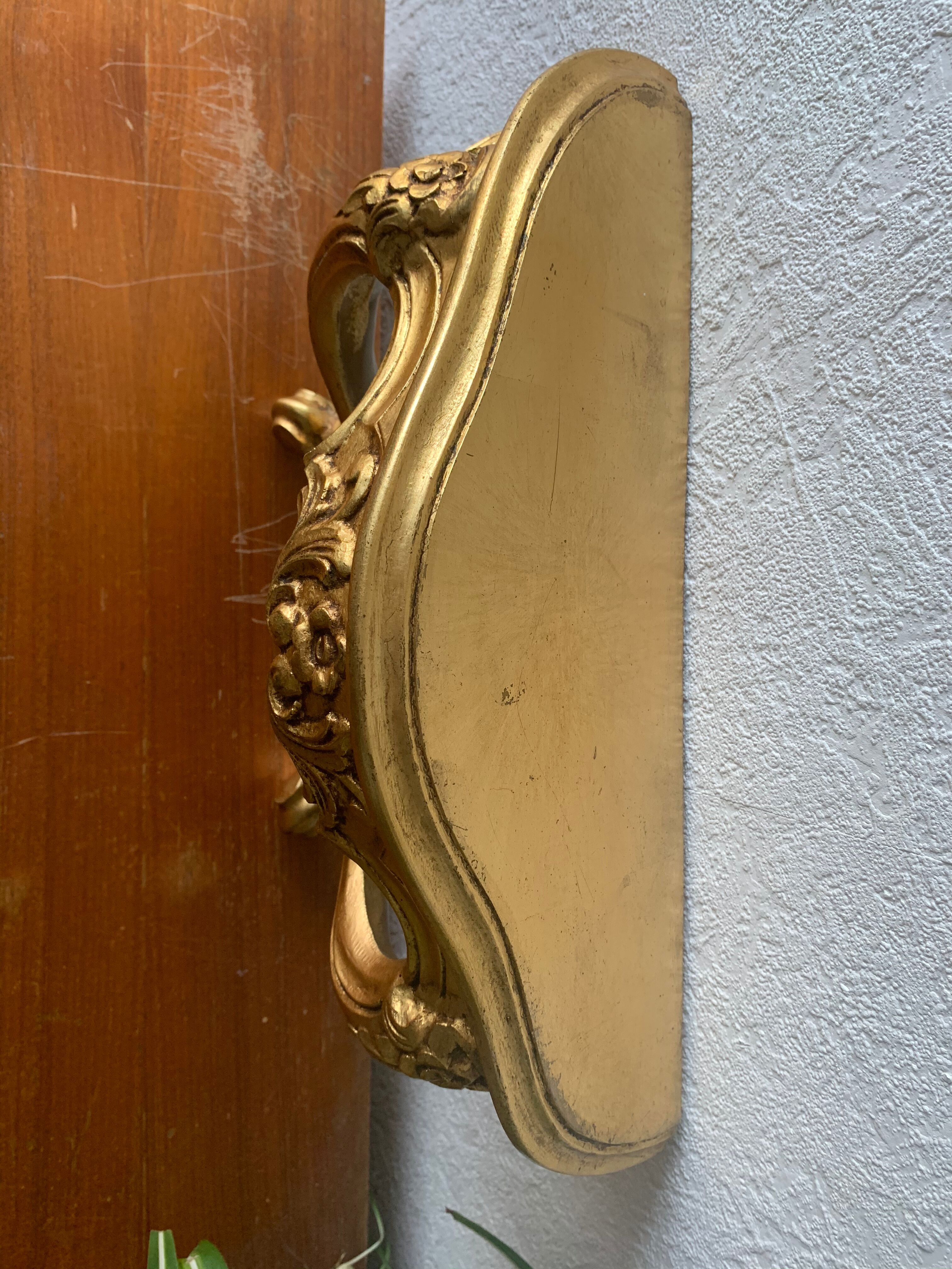 Gold wall shelf sellette