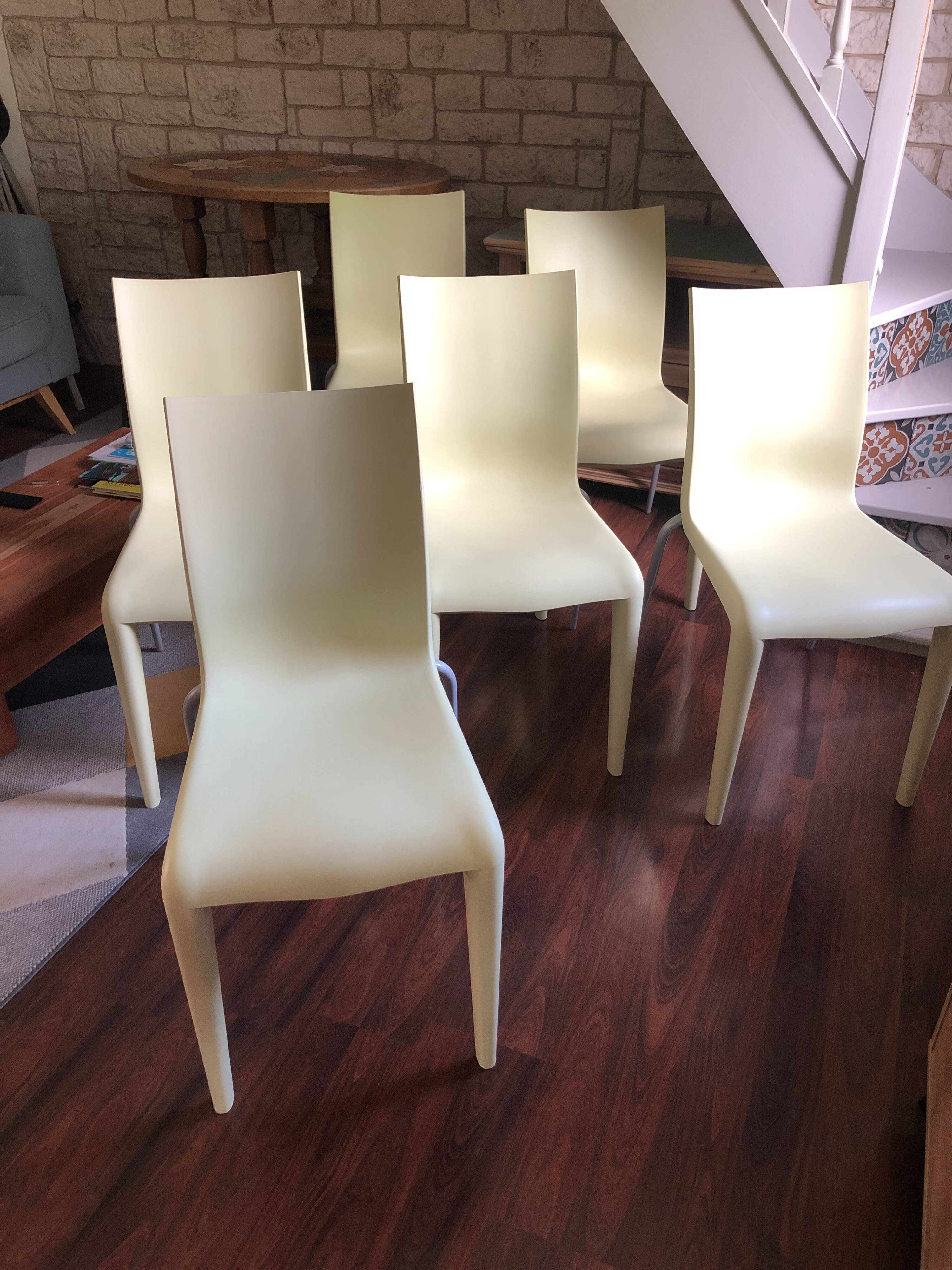Set of 6 pale yellow vintage chairs by designer Philippe Starck.