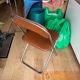 Brown folding chair in vinyl and steel