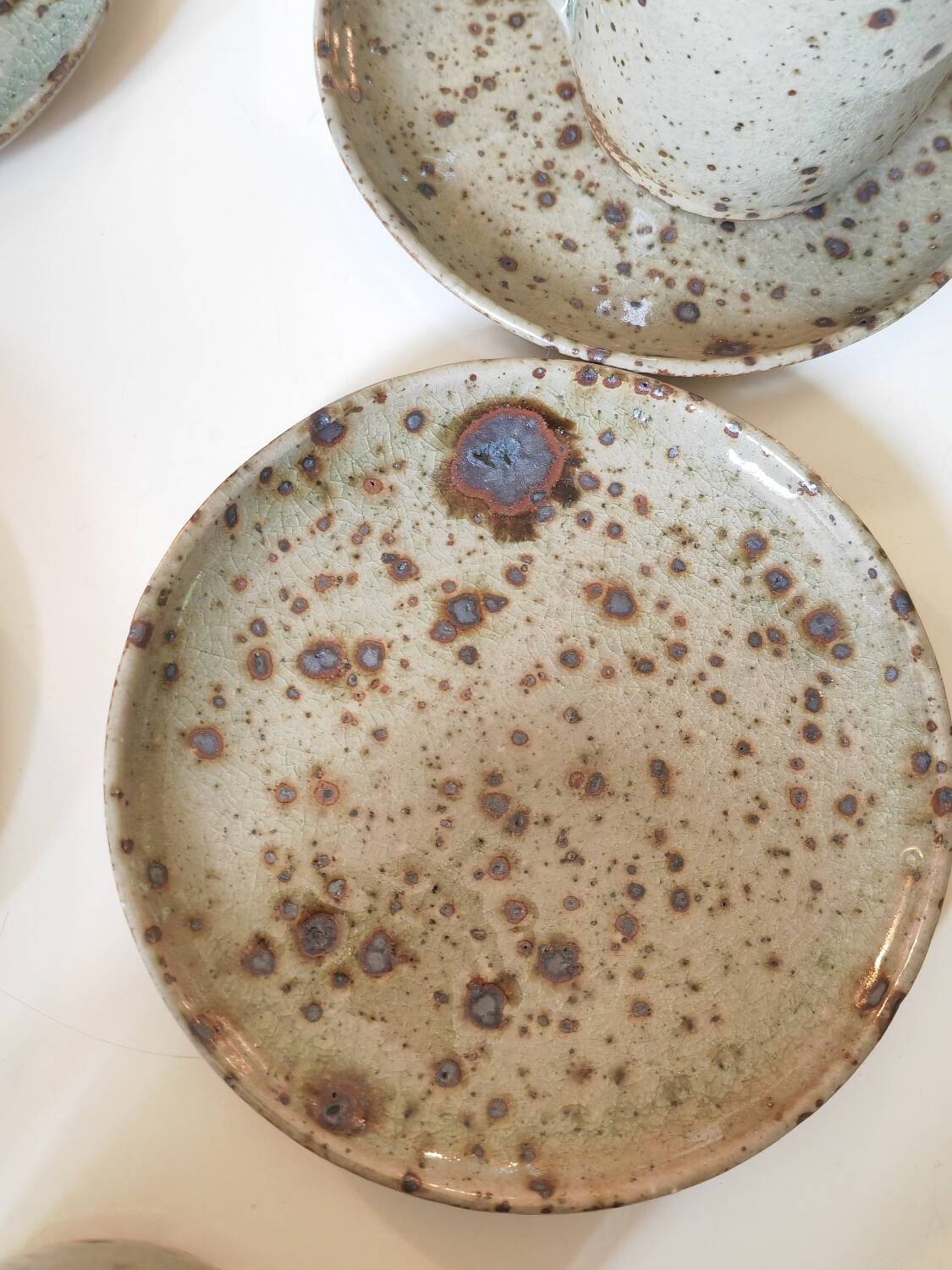 Series of stoneware cups and saucers