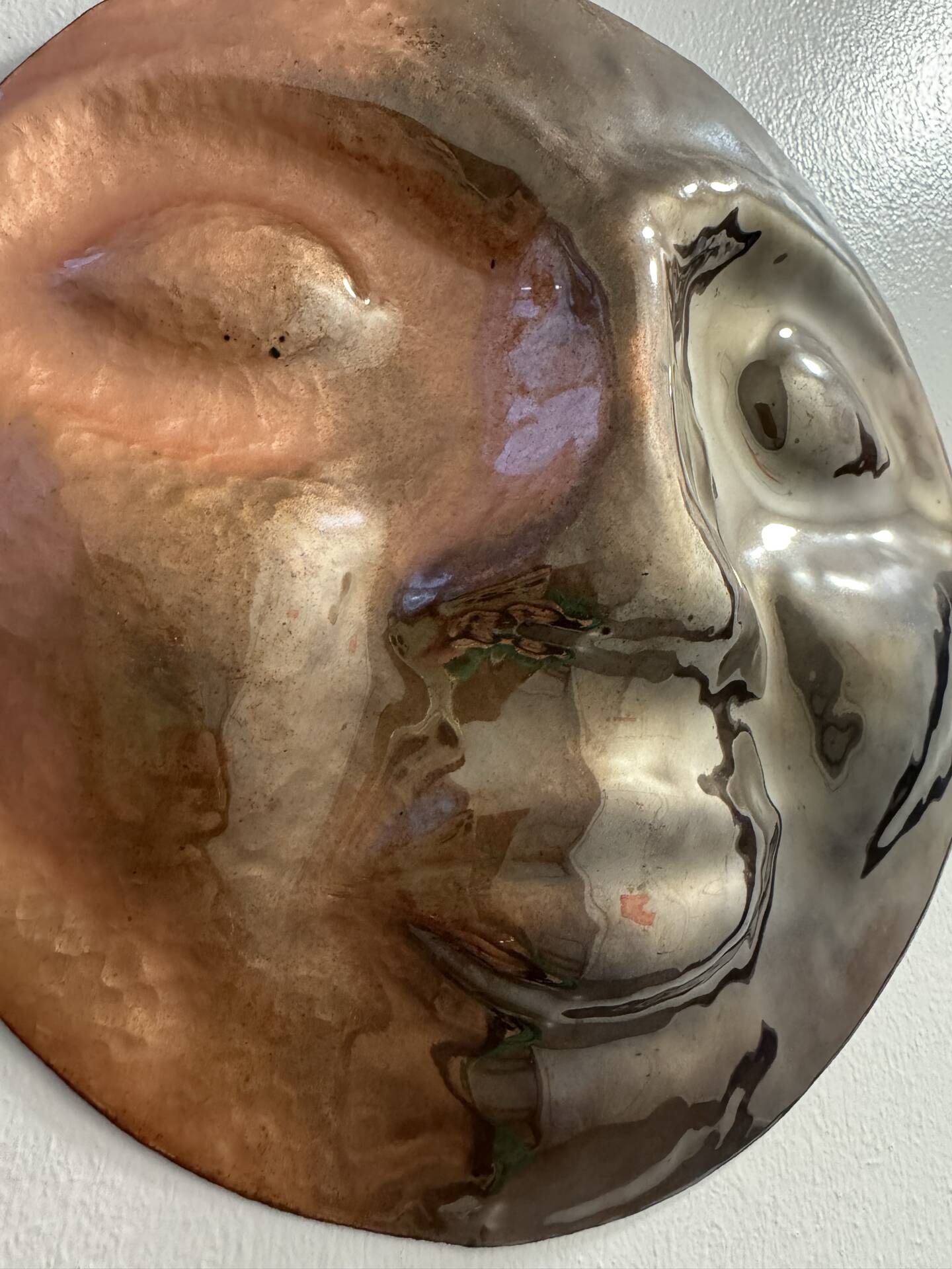 Sculpture face in embossed enamelled brass from the 1960s.