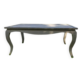 Huge table on bent legs in a rustic style.