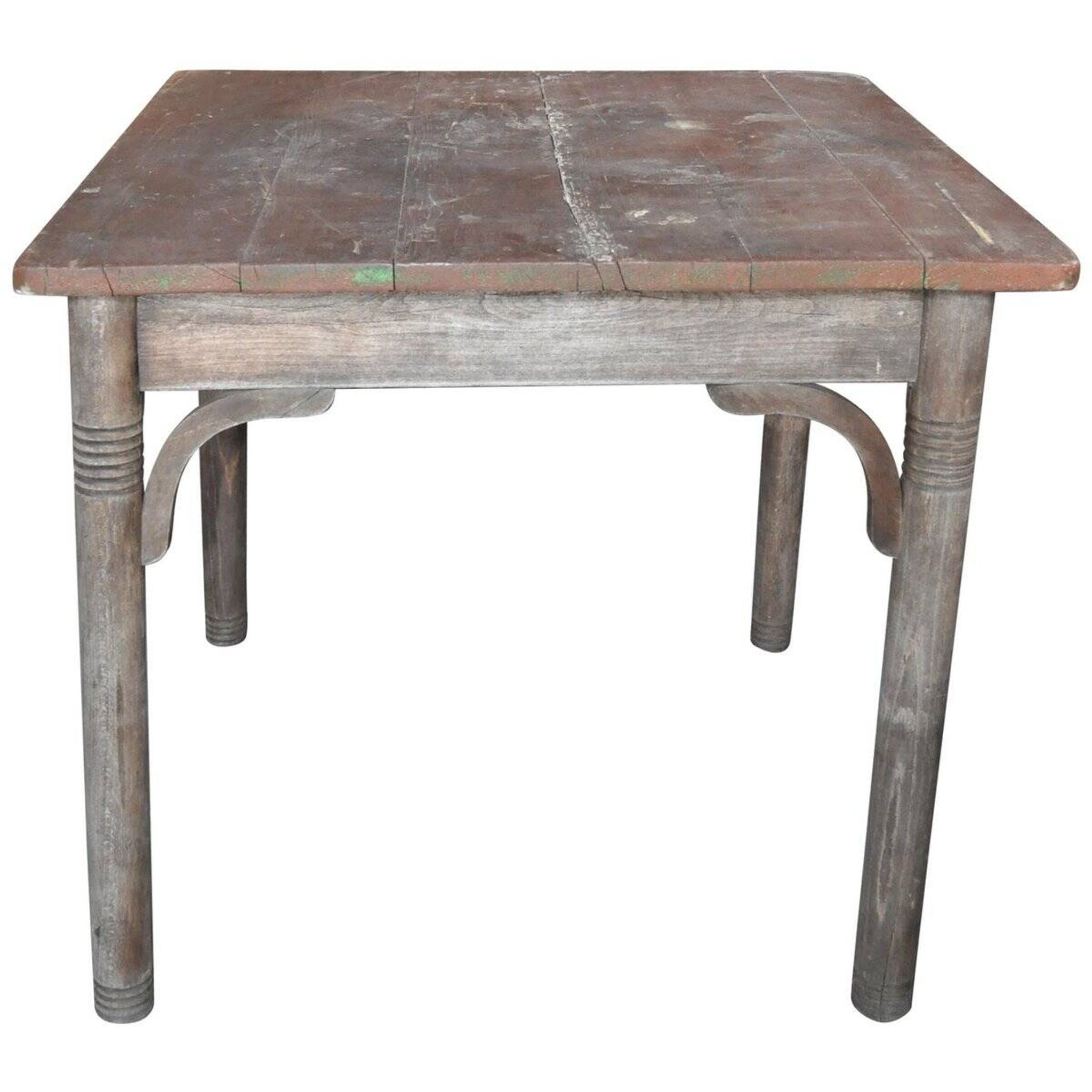Rustic Thonet table in brown beech, circa 1920, with slatted top and turned legs.