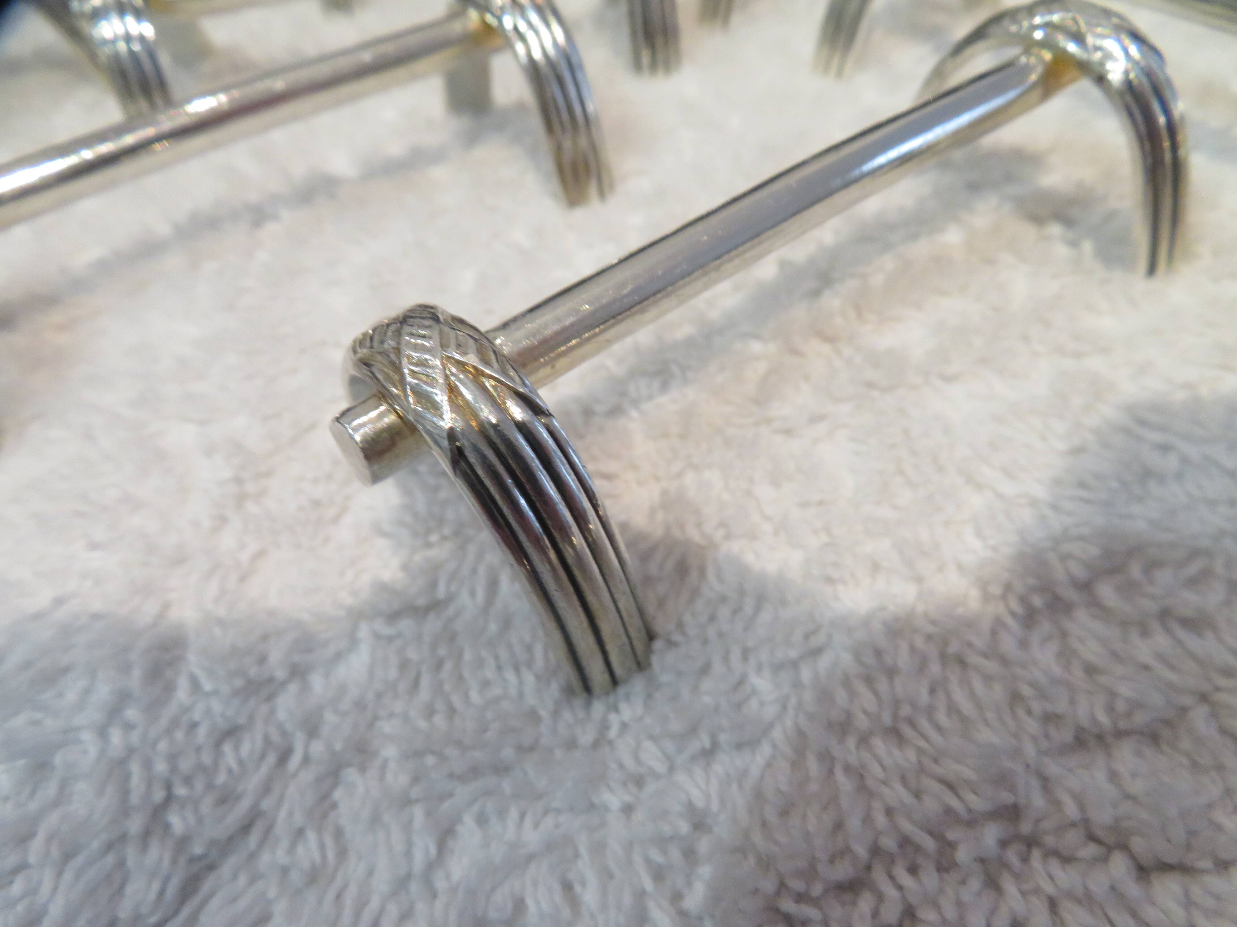 12 silver plated knife holders, goldsmith Ercuis St Louis XVI, arch shape