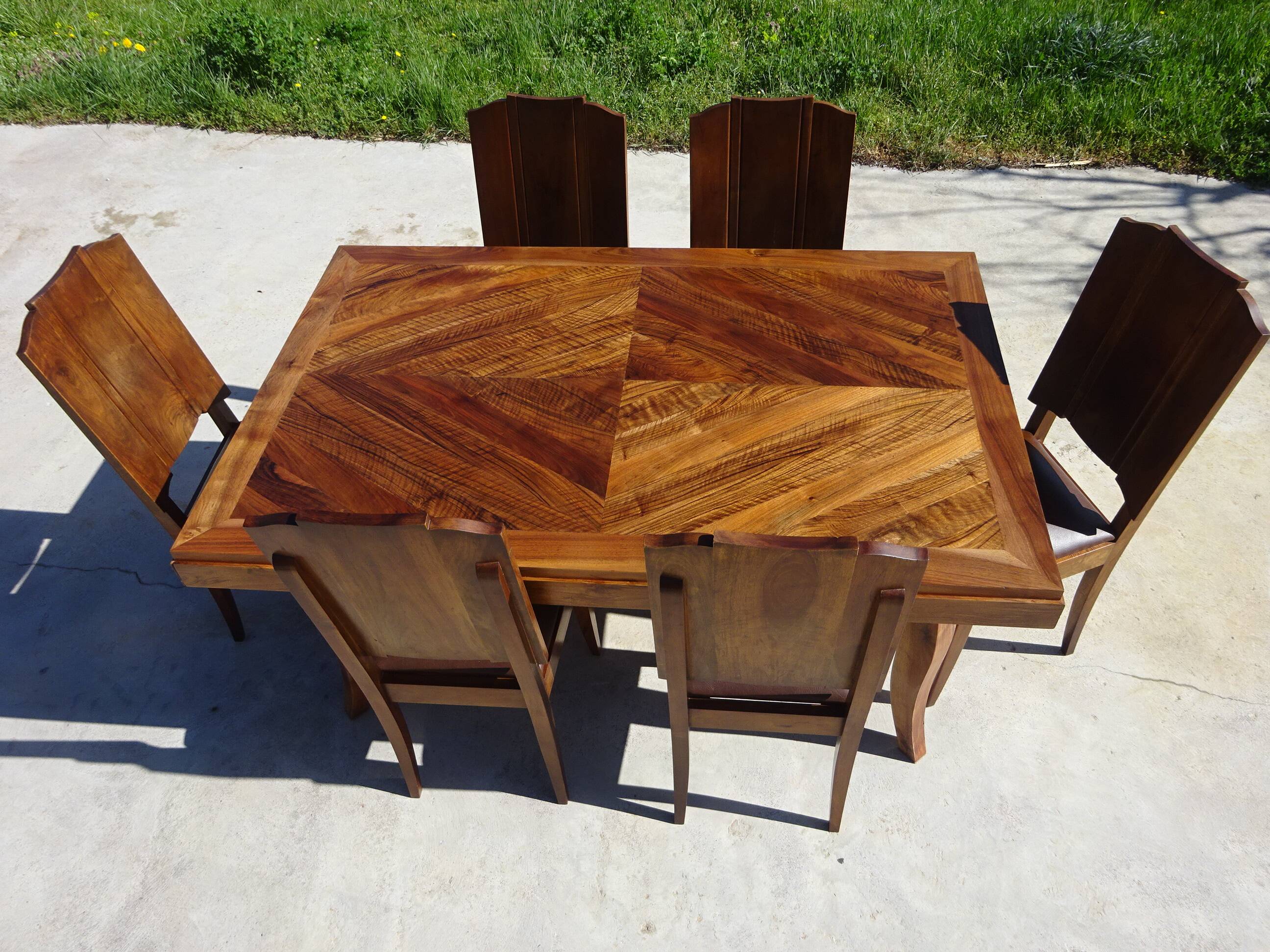 Antique solid walnut table with marquetry and extensions.
