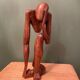 Wooden sculpture inspired by Rodin's "The Thinker"