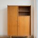 Vintage 1960s wooden wardrobe with tapered legs.
